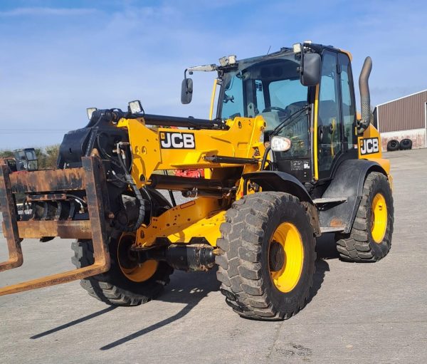 Left front side view of the JCB TM 320S tractor, showcasing its design, wheels, and front structure.