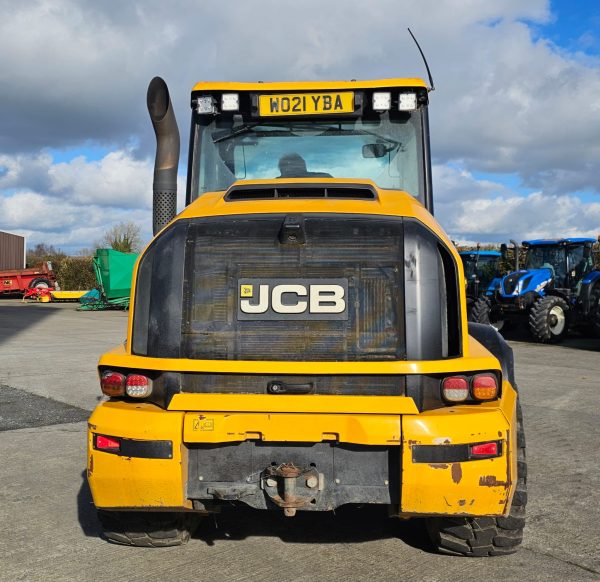 Backside view of the JCB TM 320S, showcasing its rear wheel, tow hook, and rear design features.