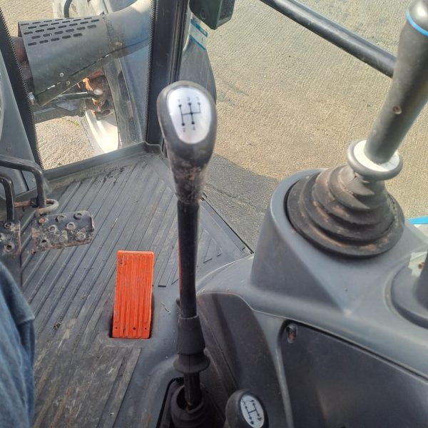 Landini Vision 105 tractor interior showing gears and pedals.