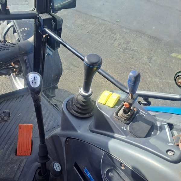 Landini Vision 105 tractor interior showing gears and pedals.