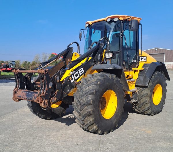 Side view of a JCB yellow tractor, with the front pointing to the southwest, showcasing its design and agricultural features.