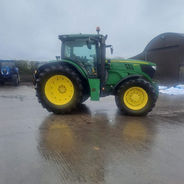 Right side view of a John Deere tractor, showcasing its design, wheels, and machinery features for agricultural use.