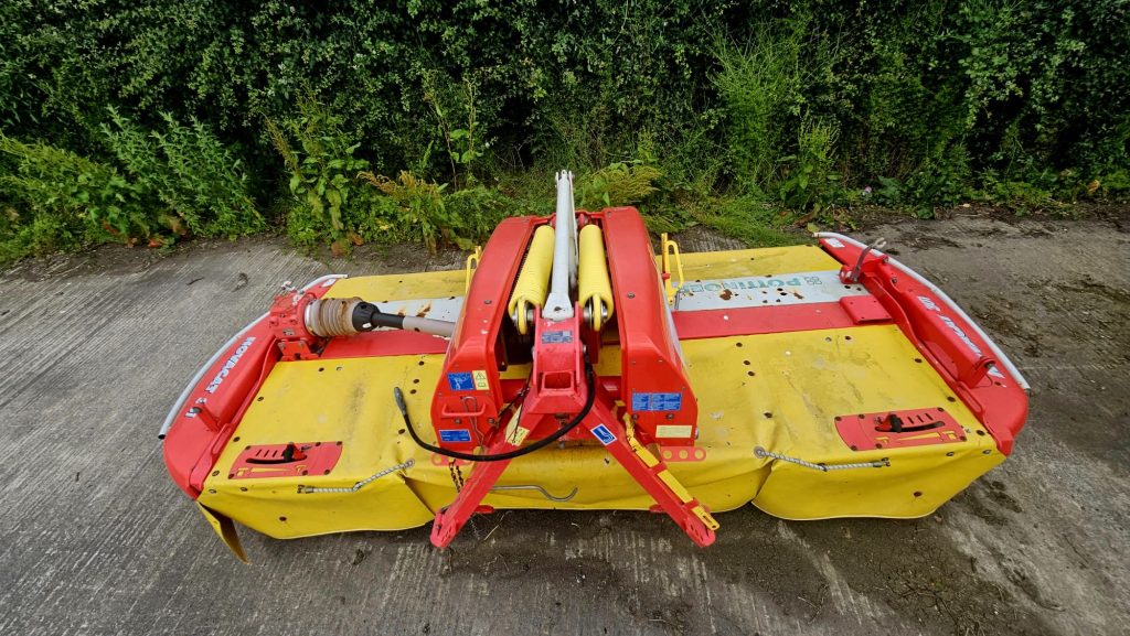 Front view of the Pottinger Mower Novacat 301 10 Foot Front Mower, showcasing its design and agricultural functionality.