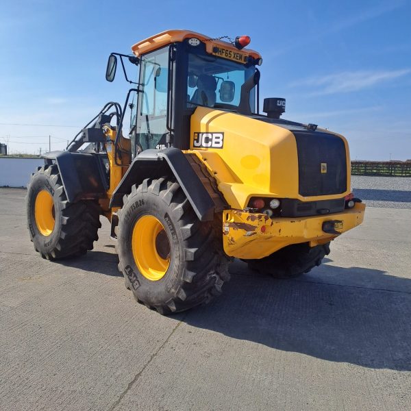 Back view of a JCB yellow tractor, with the rear facing southeast, highlighting its design and agricultural features.
