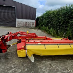 Left side view of the Pottinger Novacat 305 10 Foot Conditioner Mower, showcasing its design and agricultural features.